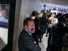 Andrew Giuliani, a White House aide and son of Rudy Giuliani, attends a news conference with his father at the Republican National Committee headquarters on Capitol Hill in Washington November 19, 2020.