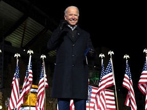 In this file photo taken on November 2, Joe Biden gestures after speaking during a Drive-In Rally at Heinz Field in Pittsburgh.