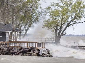 In this May 8, 2019, file photo, waves batter the shore of Lake Erie along Cotterie Park Road in Leamington.
