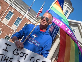 Brian Talbert, founder of LGBTQ Republican group "Deplorable Pride," promotes voting for President Donald Trump in front of the Mint Hill, North Carolina, Town Hall on November 3, 2020.