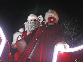 Santa and Mrs. Claus wave to passing vehicles in the Amherstburg edition of Windsor Parade Corporation's 'reverse' Santa Claus parades on Nov. 28, 2020.