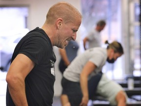 Matt Ottogalli guts out one of the 145 repetitions he performed during the Crews & Brews 20 for 20 burpee event at the Garage Gym in Amherstburg on Sunday, November 15, 2020.