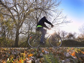 A cyclist enjoys a ride along the Ganatchio Trail in Windsor on a mild Wednesday, November 4, 2020. The city is encouraging residents to take advantage of city trails and recreation programs to stay fit during the winter.