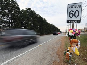 Flowers and stuffed animals are shown in the 2700 block of Jefferson Blvd. on Thursday, November 19, 2020. A 7 year-old child was struck and killed by a vehicle at the location Sunday evening.