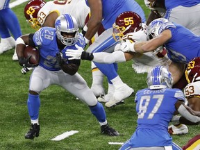 Adrian Peterson (at left with ball) will once again start at running back for the Detroit Lions with rookie D'Andre Swift out with a concussion.