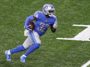 Detroit Lions running back D'Andre Swift runs after a catch for a touchdown during the third quarter against the Washington Football Team at Ford Field.