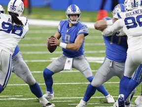 Detroit Lions quarterback Matthew Stafford tries to find space to run against the Indianapolis Colts during the third quarter at Ford Field.