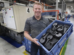 Matt Urquhart, president of Hawk Plastics Ltd. is shown with automotive components the Windsor company produces on Monday, November 9, 2020.