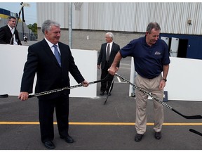 In this 2009 file photo, University of Windsor president Dr. Alan Wildeman, right, takes the initial faceoff in the newly opened ball hockey rink with Human Kinetics dean Dr. Bob Boucher, left, and Mike Havey, associate director athletics and recreation services.