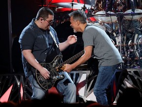 Wolfgang Van Halen performs "Panama" with his father Eddie Van Halen (right) at the 2015 Billboard Music Awards in Las Vegas, May 17, 2015.