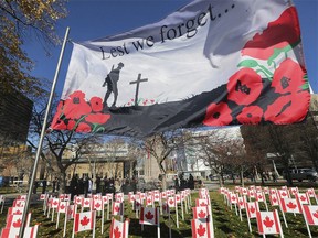 WINDSOR, ON. NOVEMBER 11, 2020 - Flags honouring fallen soldiers are shown during the Remembrance Day ceremony at the cenotaph in downtown Windsor, ON. on Wednesday, November 11, 2020. (Windsor Star- DAN JANISSE)