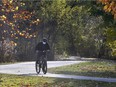 Get out this weekend as gloriously sunny and warm late-fall weather is forecast into the beginning of next week. Here on Friday, Nov. 6, 2020, a cyclist enjoys the mild weather on a section of the Little River trails in Windsor.