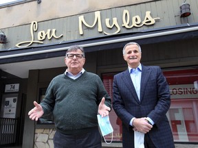 Lou Myles owners Enzo, left, and Tony Facecchia are photographed outside their downtown clothing store Monday.