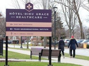 Healthcare workers head out for a walk at Hotel-Dieu Grace Healthcare on Prince Road Tuesday.  The complex is experiencing a COVID-19 outbreak.