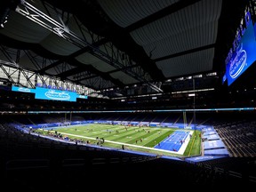 Players warm up on the field prior to a game between the Detroit Lions and the Tampa Bay Buccaneers at Ford Field on December 26, 2020 in Detroit, Michigan.