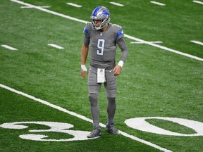 Matthew Stafford of the Detroit Lions reacts in pain after a sack during the first quarter of a game against the Tampa Bay Buccaneers at Ford Field on December 26, 2020 in Detroit, Michigan.