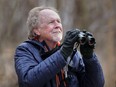 Naturalist Paul Pratt searches for birds at the tip of Point Pelee National Park Tuesday.