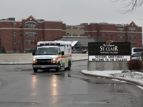 An ambulance leaves the village in St Clair in Windsor.  The long-term care facility has recorded the highest COVID-19 death toll of any single location in the region.