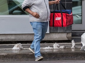 A Skip The Dishes delivery driver in Ottawa wears a mask during the COVID-19 outbreak.