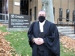 Pandemic protection. A murder trial set to begin this week was postponed due to COVID-19. Shown outside downtown Windsor's Superior Court of Justice on Friday, Dec. 4, 2020, is Daniel Topp, president of the Windsor-Essex Criminal Lawyers' Association.