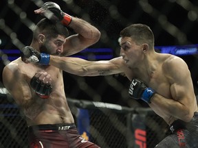 Aiemann Zahabi (left) fights Vince Morales during UFC Fight Night at Canadian Tire Centre in Ottawa.