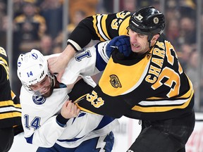 Boston Bruins defenceman Zdeno Chara (33) fights with Tampa Bay Lightning left wing Pat Maroon (14) during the second period at TD Garden.