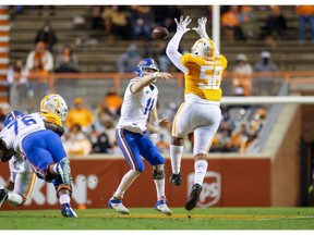 Dec 5, 2020; Knoxville, Tennessee, USA; Florida Gators quarterback Kyle Trask (11) passes the ball while being pressured by Tennessee Volunteers defensive lineman Omari Thomas (58) during the second half at Neyland Stadium. Mandatory Credit: Randy Sartin-USA TODAY Sports ORG XMIT: IMAGN-427312