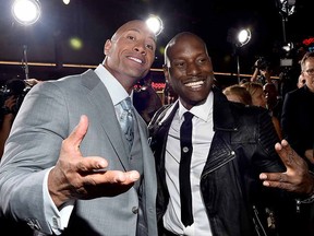 Dwayne Johnson (left) and Tyrese Gibson attend Universal Pictures' "Furious 7" premiere at TCL Chinese Theatre on April 1, 2015 in Hollywood.