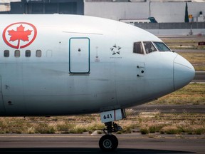 An Air Canada plane prepares to take off at the Benito Juarez International airport, in Mexico City, amid the COVID-19 pandemic, May 20, 2020.