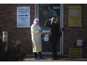 Medical staff are seen outside the COVID-19 Assessment Centre at Windsor Regional Hospital's Ouellette Campus, Thursday, Dec. 10, 2020.