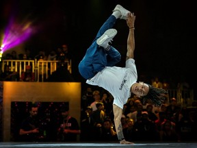 In this file photo taken Nov. 9, 2019, Brazil's breakdancer Mateus de Sousa Melo aka Bart competes during the Red Bull BC One, the breakdance one-on-one battle world championship in Mumbai, India.
