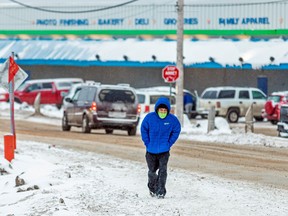 A man wears a mask to help slow the spread of coronavirus disease (COVID-19) as the territory of Nunavut enters a two week mandatory restriction period in Iqaluit, Nunavut, Canada November 18, 2020.