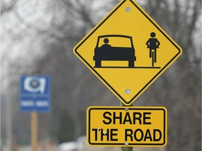 A "Share the Road" sign is shown along Old Tecumseh Road in Lakeshore on March 21, 2019.