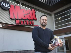 Marc Romualdi, owner of M.R. Meat Market, is shown at the Walker Road location on Thursday, December 10, 2020. The business has donated more than $288,000 worth of  food to Windsor Lifeline Outbreak food bank.