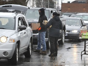 Unifor Local 444 members with Caesars Windsor line up to pick up care packages at the Turner Road union hall on Thursday, December 17, 2020. The event, meant to help out Caesars workers whose workplace has been shut down by the COVID-19 pandemic, featured packages containing a turkey, potatoes, stuffing, veggies and various canned and dry goods. It was originally scheduled from 9 a.m. to noon but there was such a large turnout that supplies were gone by 10:30 a.m. Unifor is planning another drive-thru event for members who missed out.