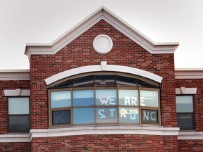 A message in the windows of The Village at St. Clair, a long-term care facility under Schlegel Villages, located in Windsor. Photographed Dec. 15, 2020.