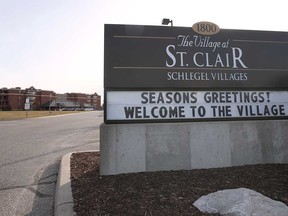A sign at the entrance of The Village at St. Clair, a long-term care facility under Schlegel Villages, located in Windsor. Photographed Dec. 15, 2020.