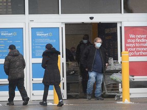 Customers at the exit of the Walmart location in Windsor's east end on Dec. 26, 2020.