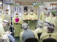 Front-line medical staff hold a meeting at the Windsor Regional Hospital field hospital at the St. Clair College SportsPlex on May 13, 2020, during the COVID-19 pandemic.