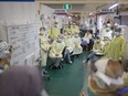 Front-line medical staff hold a meeting at the Windsor Regional Hospital field hospital at the St. Clair College SportsPlex on May 13, 2020, during the COVID-19 pandemic.
