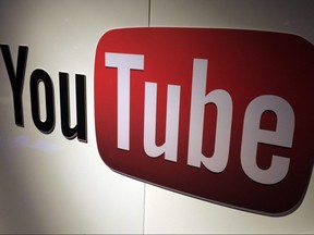 In this file photo a YouTube logo is seen during LeWeb Paris 2012 in Saint-Denis near Paris, Dec. 4, 2012.