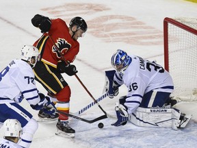A shot by the Calgary Flames’ Matthew Tkachuk is saved by Toronto Maple Leafs goaltender Jack Campbell during the third period at the Saddledome in Calgary on Sunday, Jan. 24, 2021.