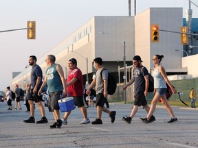 Autoworkers leave the Windsor Assembly Plant following their shift earlier this year.