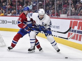 Canadiens defenceman Victor Mete checks Toronto Maple Leafs captain John Tavares during game at the Bell Centre on Feb. 8, 2020.