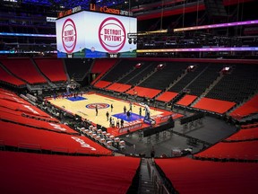 The Detroit Pistons and Boston Celtics warm up before the game at Little Caesars Arena on January 01, 2021 in Detroit, Michigan.