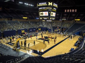 The Michigan Wolverines and Maryland Terrapins warm up at Crisler Arena on January 19, 2021 in Ann Arbor, Michigan.