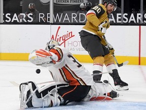 John Gibson of the Anaheim Ducks makes a save against Chandler Stephenson of the Vegas Golden Knights in the second period of their game at T-Mobile Arena on January 16, 2021 in Las Vegas, Nevada. The Golden Knights defeated the Ducks 2-1 in overtime.
