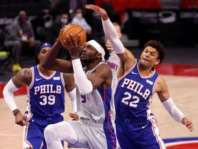 Jerami Grant of the Detroit Pistons tries to get to the basket past Matisse Thybulle of the Philadelphia 76ers during the second half at Little Caesars Arena on January 25, 2021 in Detroit, Michigan. Detroit won the game 119-104.