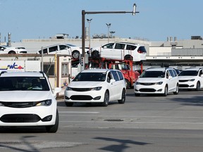 A caravan of brand new Chrysler Pacificas departs FCA's Windsor Assembly Plant on Walker Road on Nov. 10, 2020.