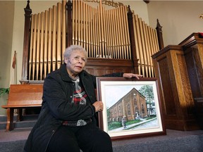 Not Black enough? Church clerk Nancy Allen is shown inside Windsor's British Methodist Episcopal Church Ontario Chapel on University Avenue East on Wednesday. Jan. 20, 2021. Allen holds an image of the original church which dates back to 1856.